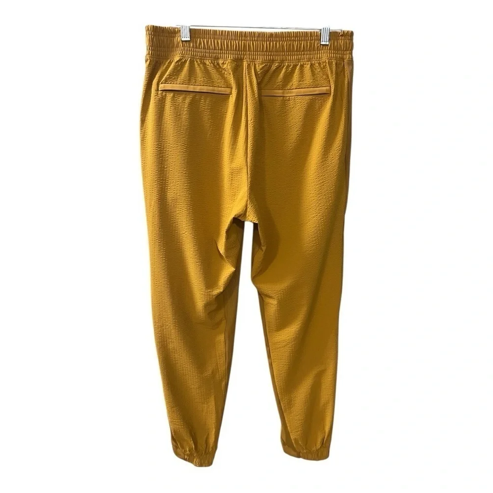 ATHLETA Brooklyn Joggers Women’s  NWOT Size 10 Gold